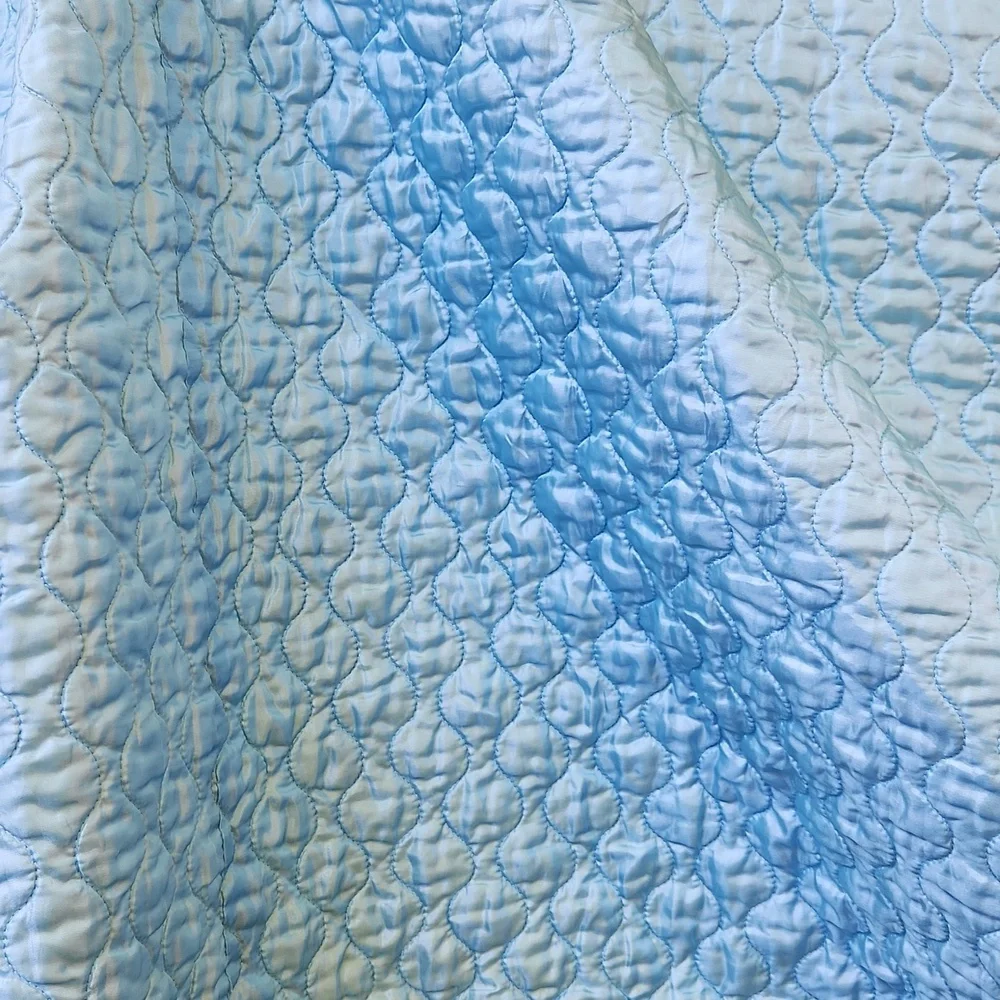 Vintage 1990s blue satin quilted twin size comforter bedspread .